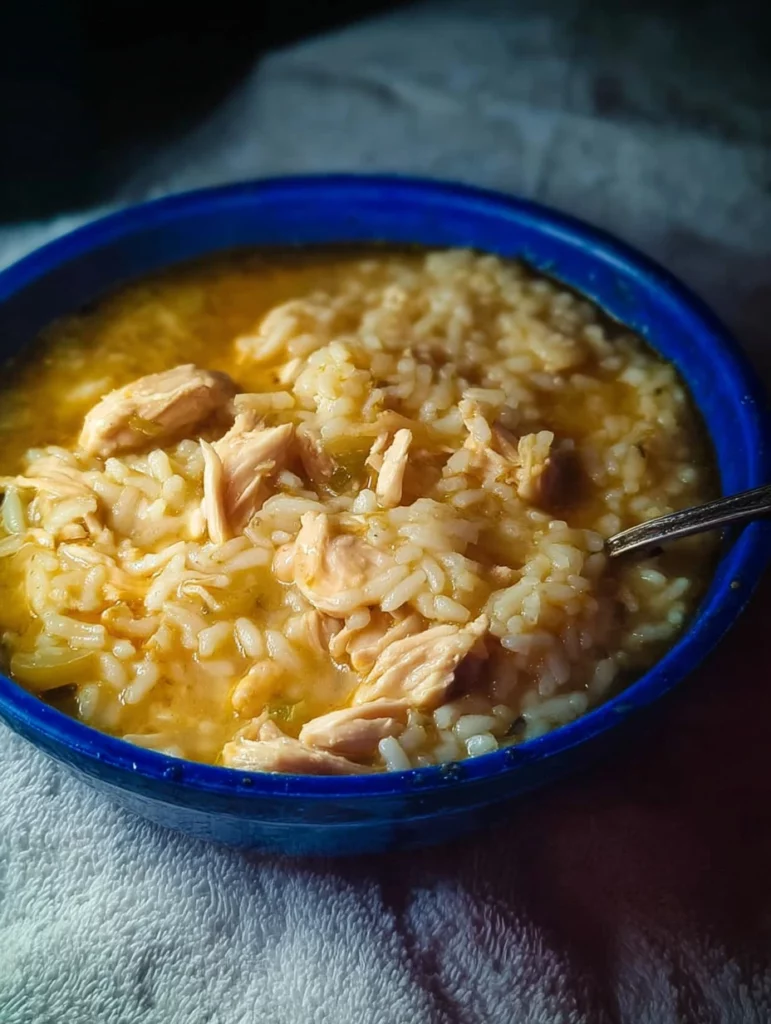 Delicious oven baked chicken served with rice in a ceramic dish