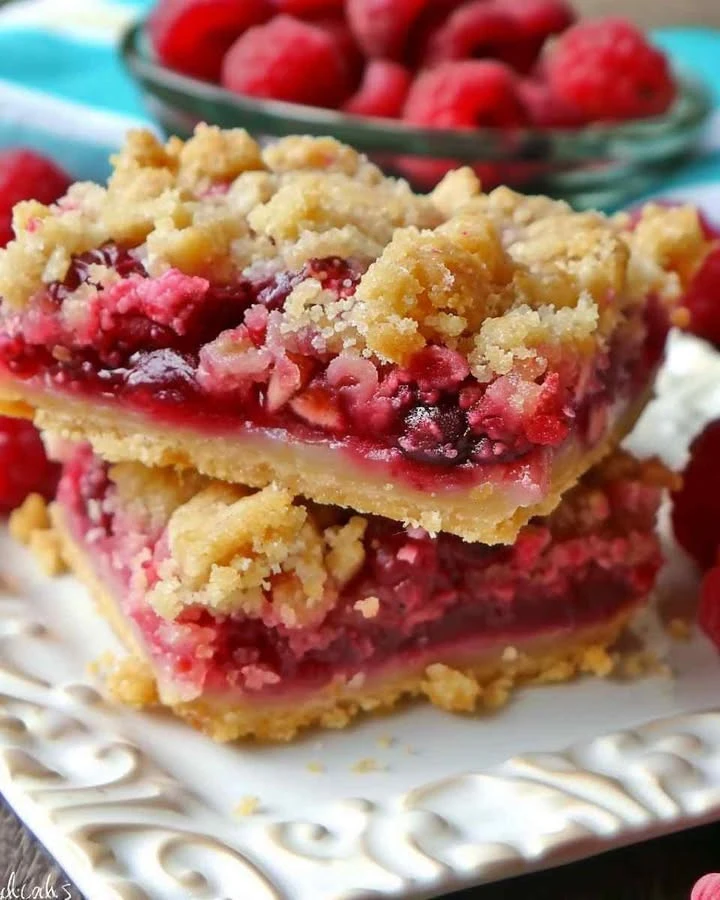 Delicious raspberry crumble bars with buttery crumble topping