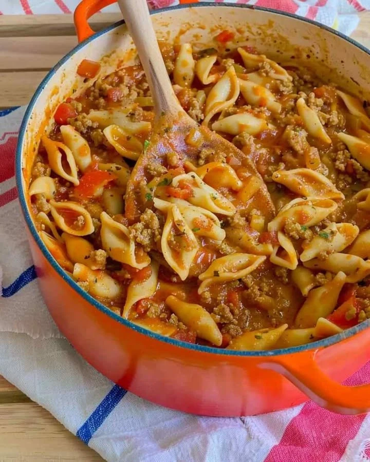 Delicious taco pasta dish topped with cheese and fresh cilantro