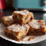 Delicious air fryer bread pudding served in a bowl with vanilla sauce