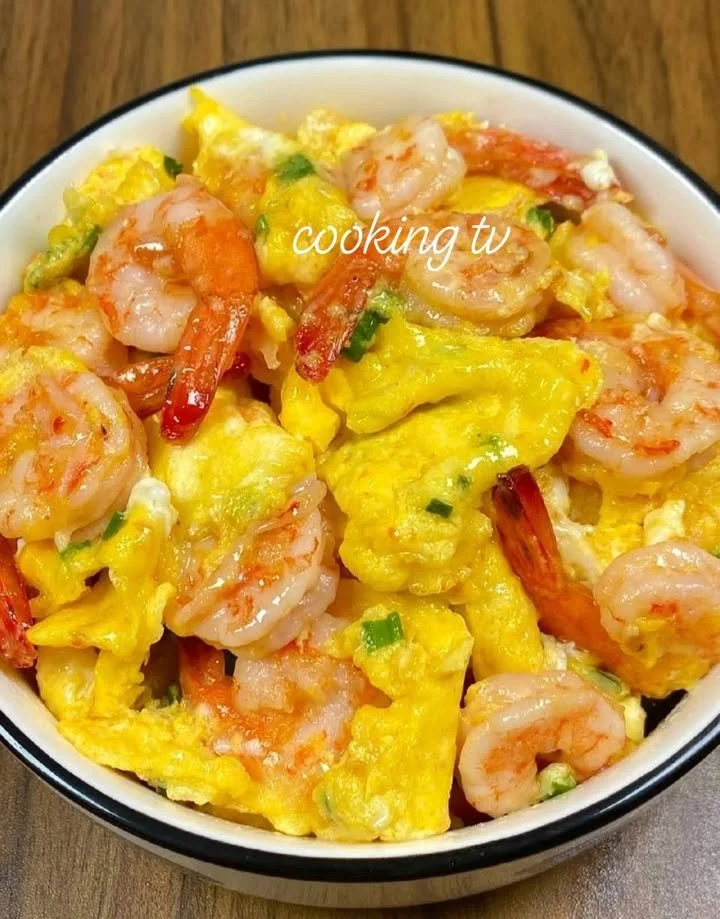 Shrimp and scrambled eggs dish served on a plate