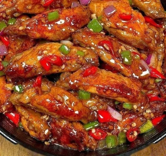 Delicious spicy garlic chicken wings served on a platter.