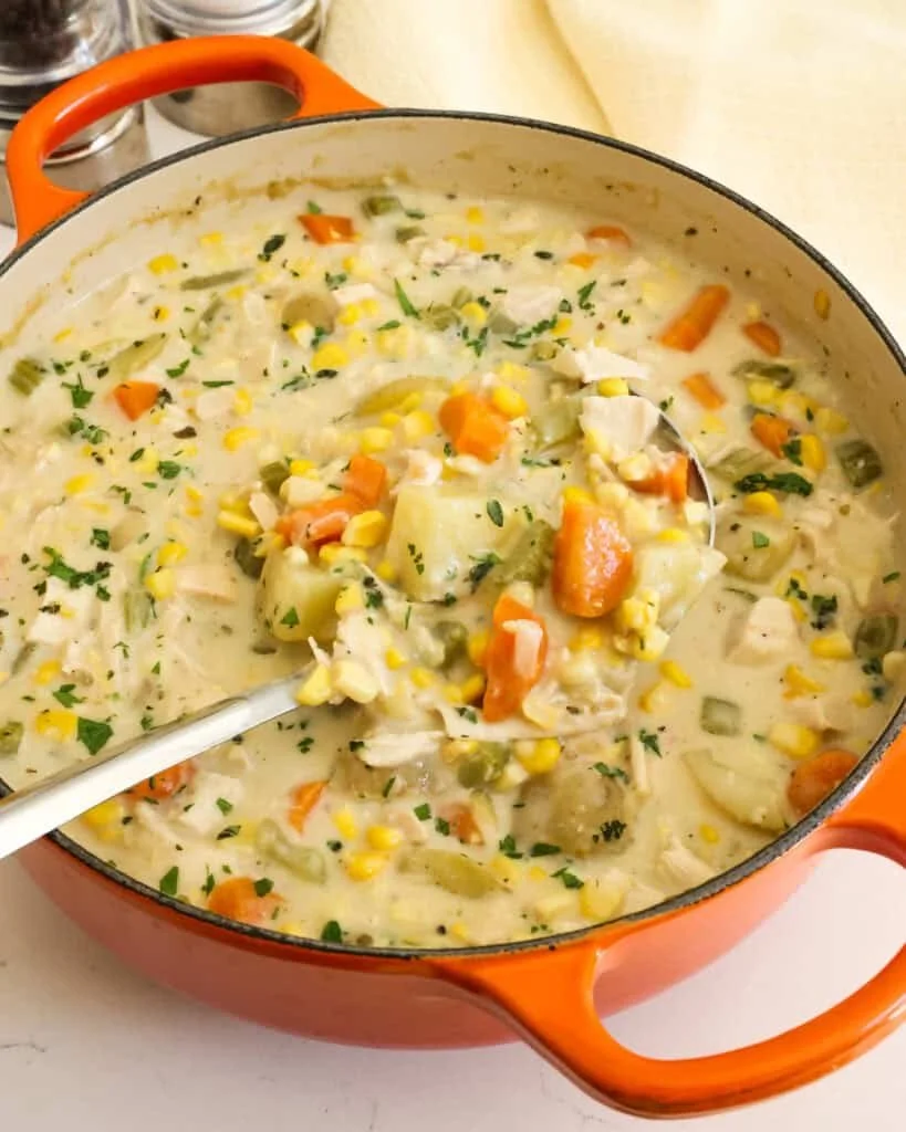 Delicious bowl of Chicken Corn Chowder with vegetables and herbs