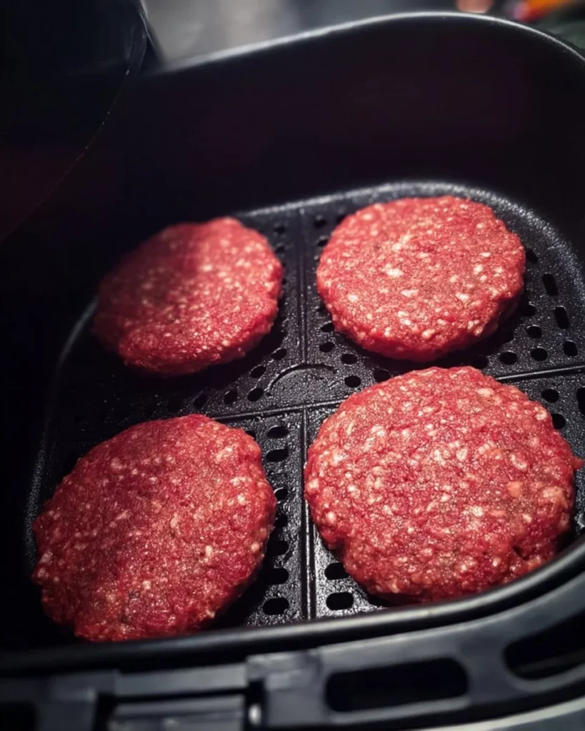 Juicy air fryer hamburgers ready to be served on a plate