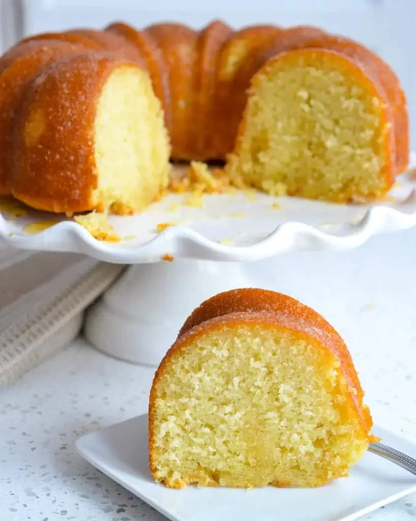 Deliciously moist Kentucky Butter Cake served with a drizzle of icing on top.