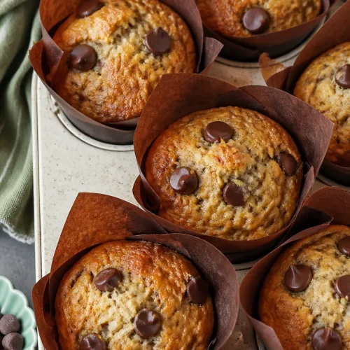 Delicious banana chocolate chip muffins, super moist and bakery-style, fresh out of the oven